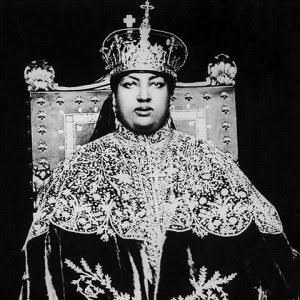 Empress Menen seated in ceremonial dress